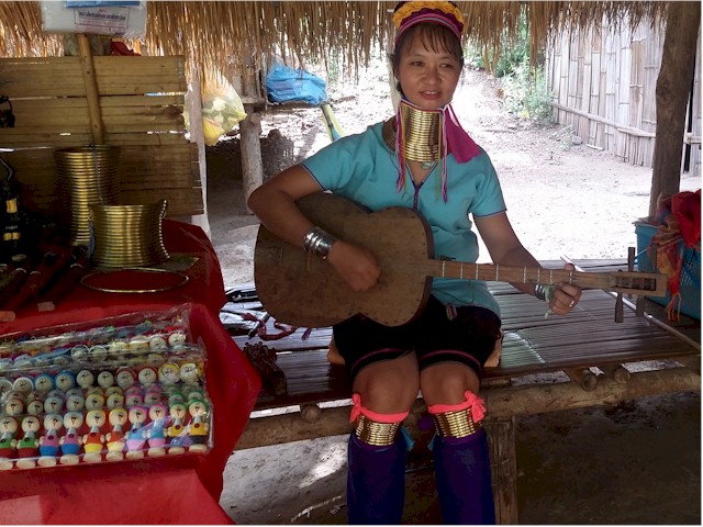 SE Asia Tour 2014 This teenage girl has several rings on her neck as well as on the arms and legs.