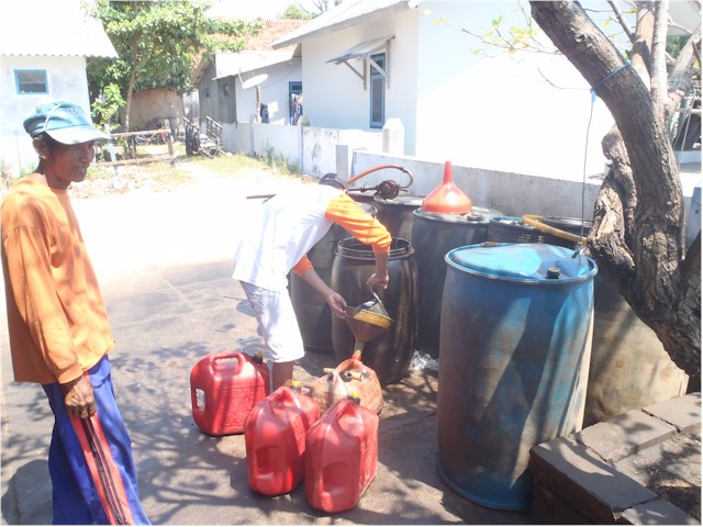 Indonesia Part 2 through to Malaysia 2013 Diesel being scooped from a drum into our jerry cans in the Karimunjawa Islands...