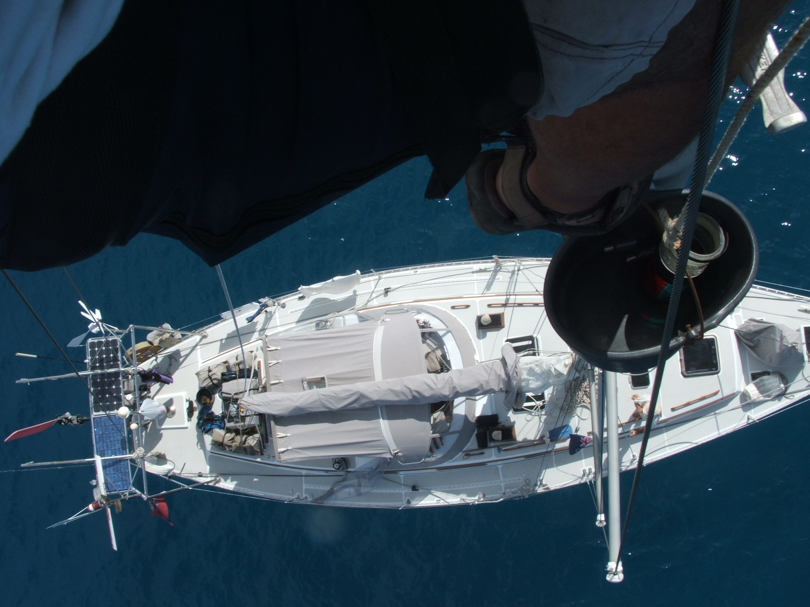 Suwarrow Atoll and Tonga 2006 Looking down at Poco Andante from the top of our mast (Keith was repairing our masthead light).