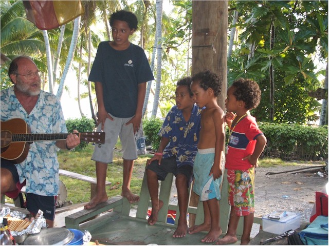 Suwarrow Atoll and Tonga 2006 Chris from Magic Carpet teaches the boys a new song.