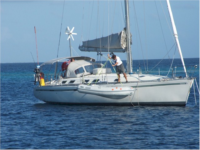 Suwarrow Atoll and Tonga 2006 Lucy and Jamie from Savoir Vivre raise their dinghy.