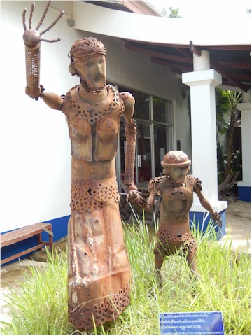 SE Asia Tour 2014 This sculpture is made from war debris and shows that the victims include women and children. A sad but inspiring memory of Laos.