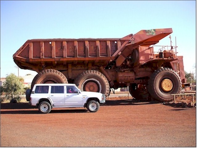 'Betty' is dwarfed by the 300 ton truck! Apparently they prefer women drivers for these monsters!