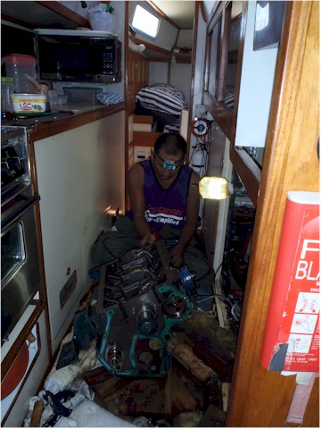 Matt working on the engine in the galley.