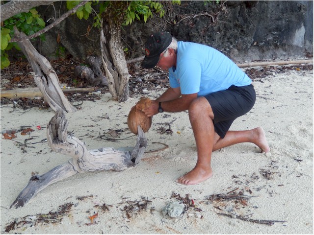 ... Keith breaks it open so Xavi can try fresh coconut juice.