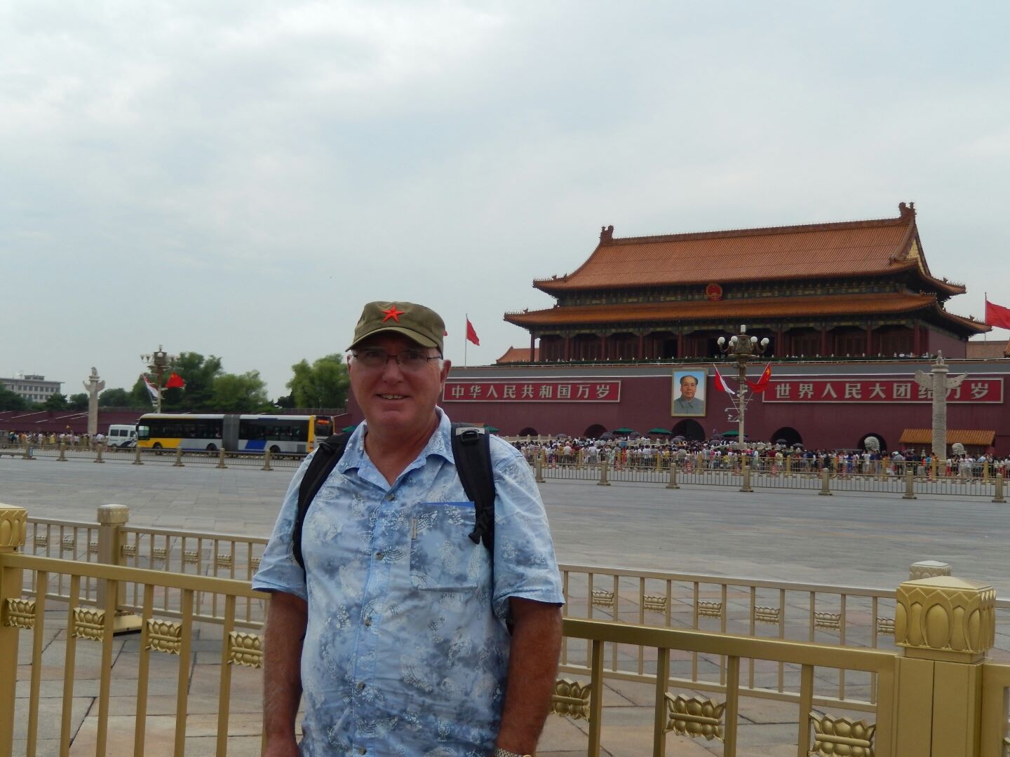 Keith opposite the Forbidden City - including a huge portrait of Chairman Mao.