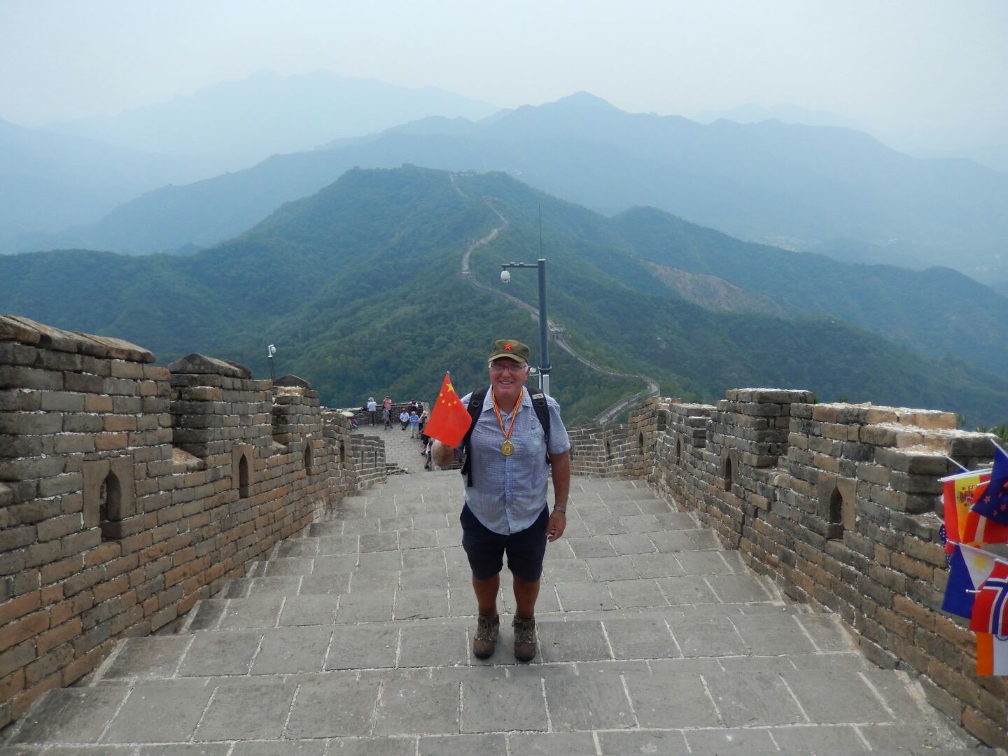 Keith returns from walking all the way to the top of this section of the Great Wall - with a medal to prove it!