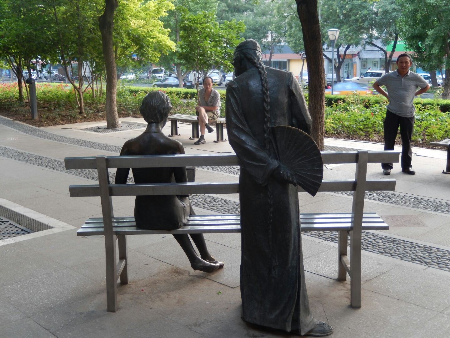 With the traditionally garbed older gentleman peering over her shoulder!