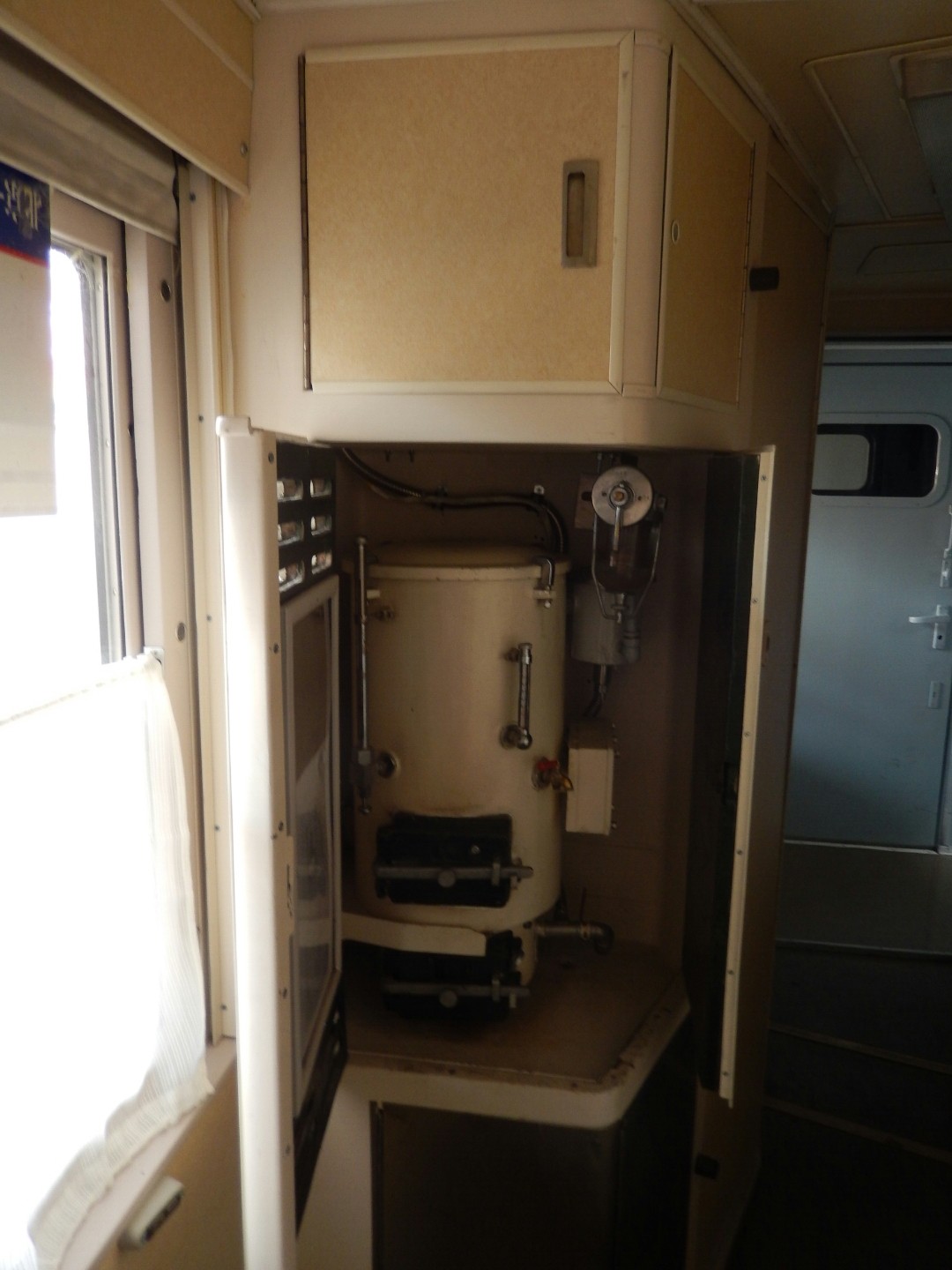 The samovar for hot water at the end of each carriage.