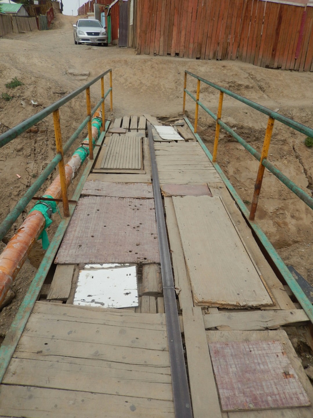 ... and the rickety pedestrian bridge to get to town.