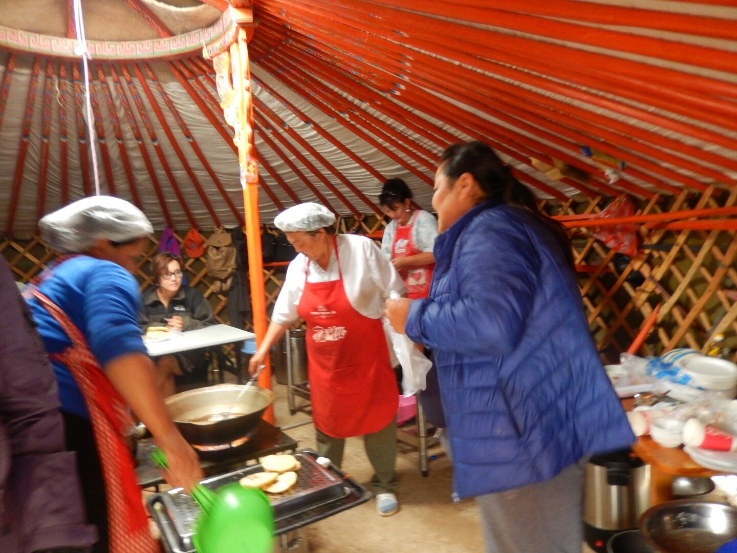 Inside a ger, the women prepare "hursure" - our best attempt at interpreting this snack.