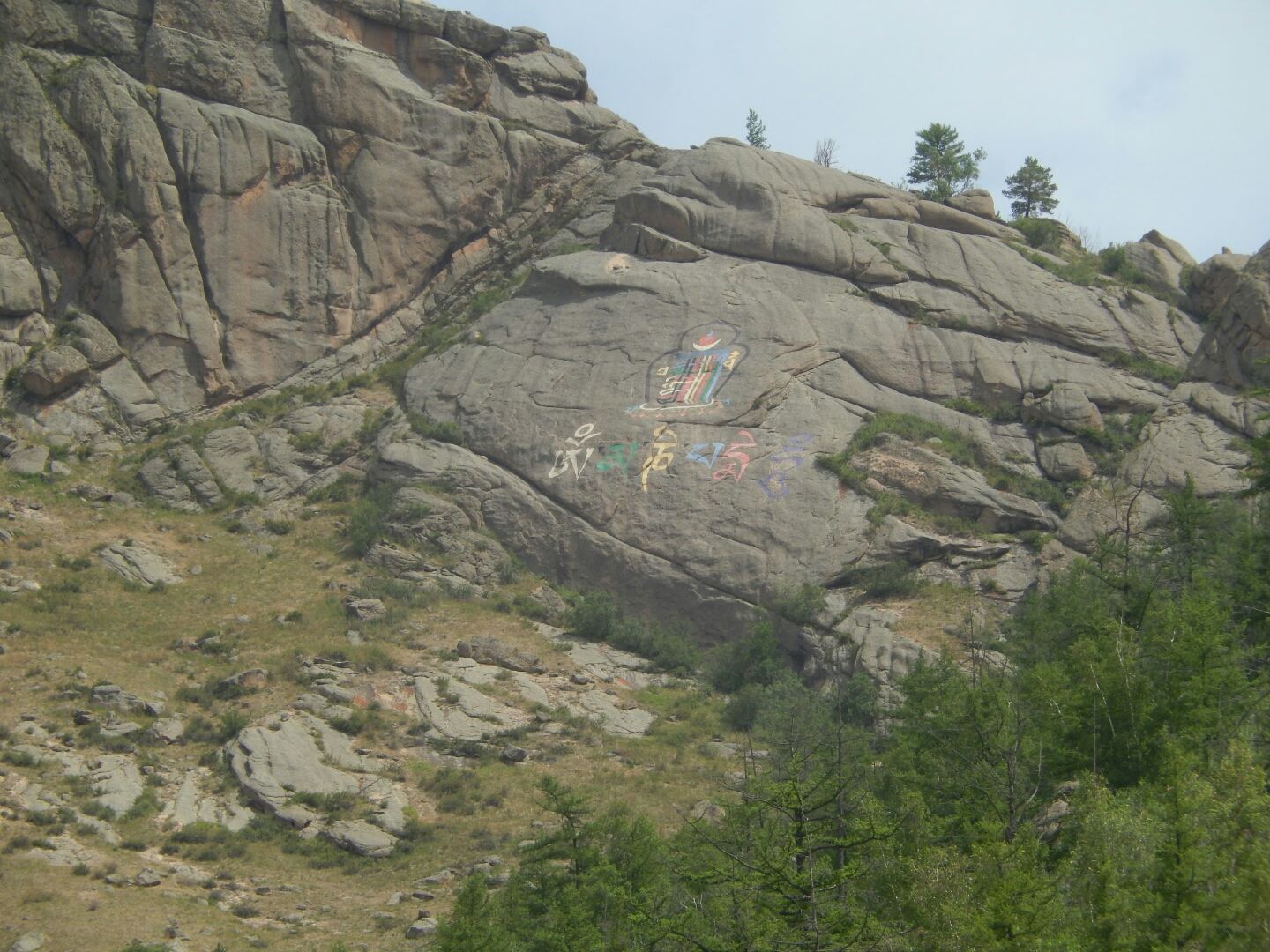 ... on the way, these huge symbols are painted on the cliff face.