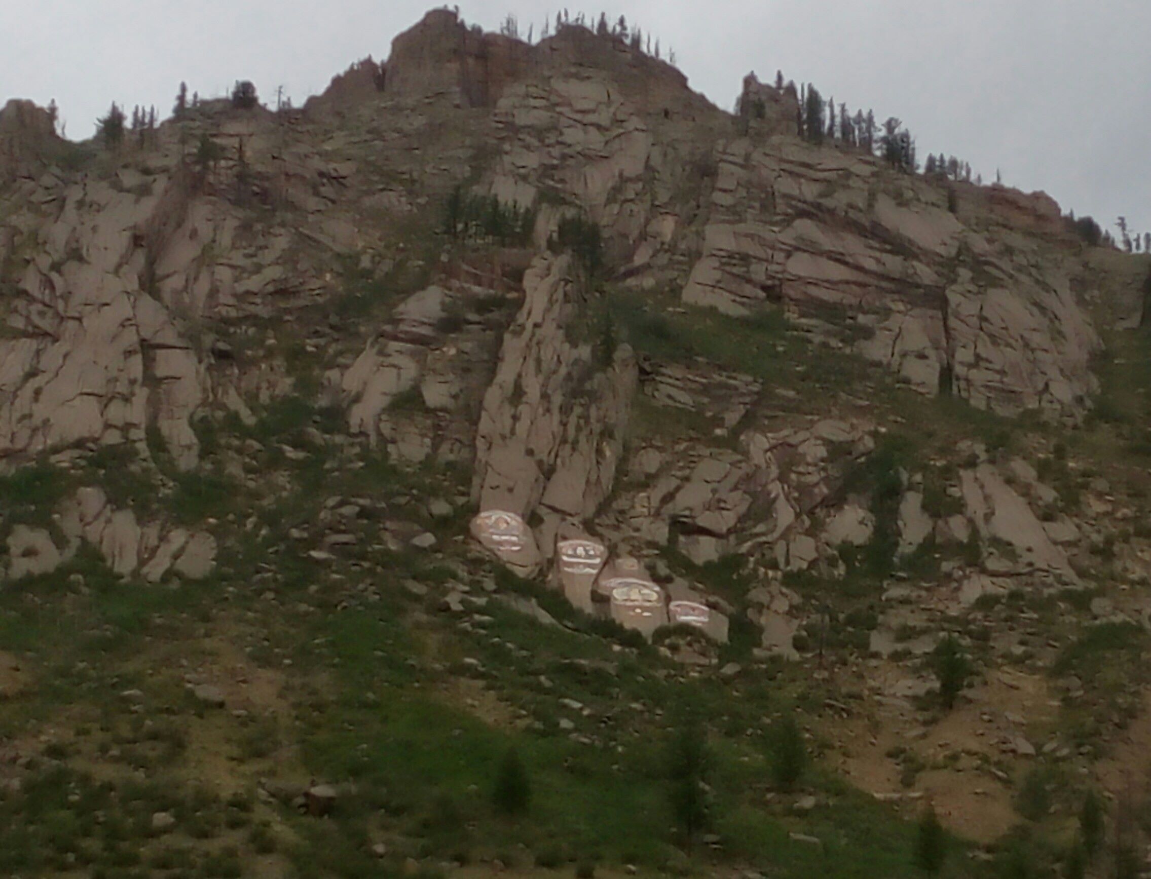 ... on the way, these huge symbols are painted on the cliff face.