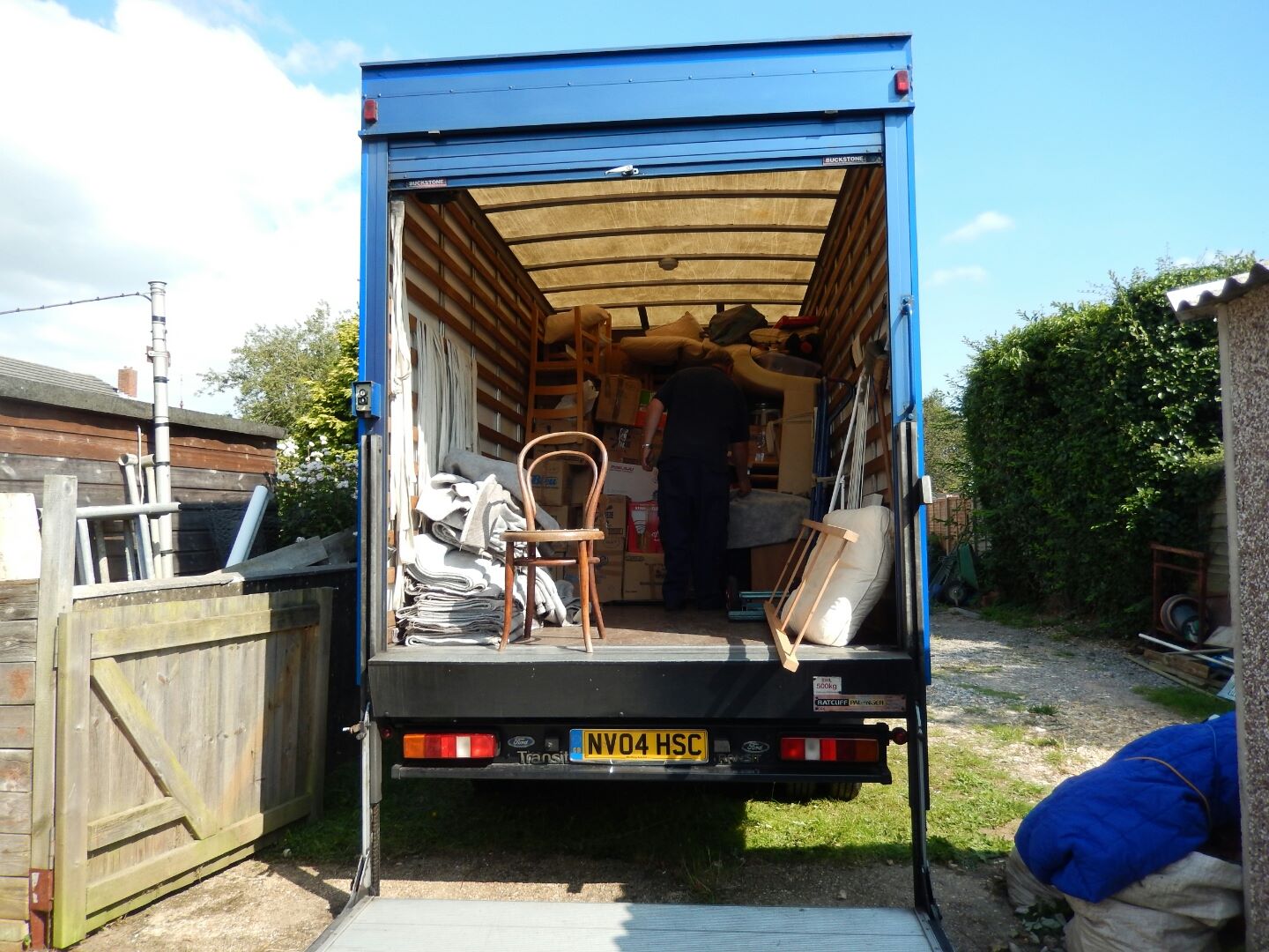 The removals van arrives at the house.