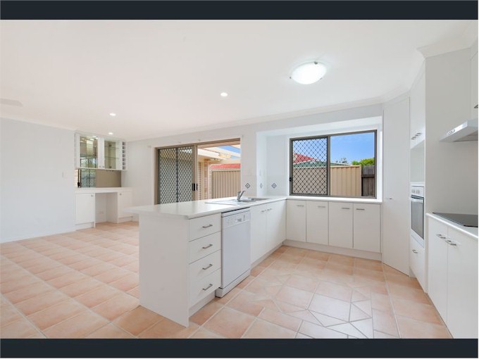 The dining area also has a bar and the kitchen has large pantry.