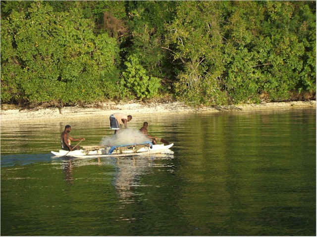 At Ai Creek on Efate Island - local men going fishing at dusk.
