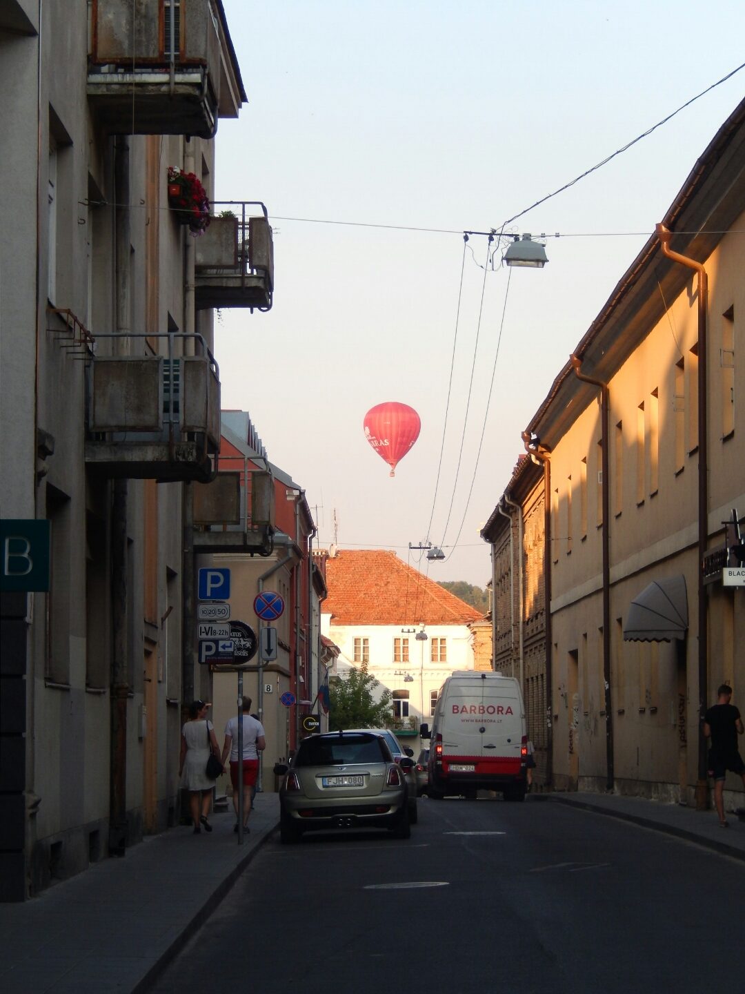 ... as a hot air balloon ascends over the city.
