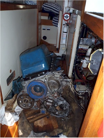 The engine apart and sitting in the galley - in the end for 6 weeks! - and we had to clamber over it to get to bed!
