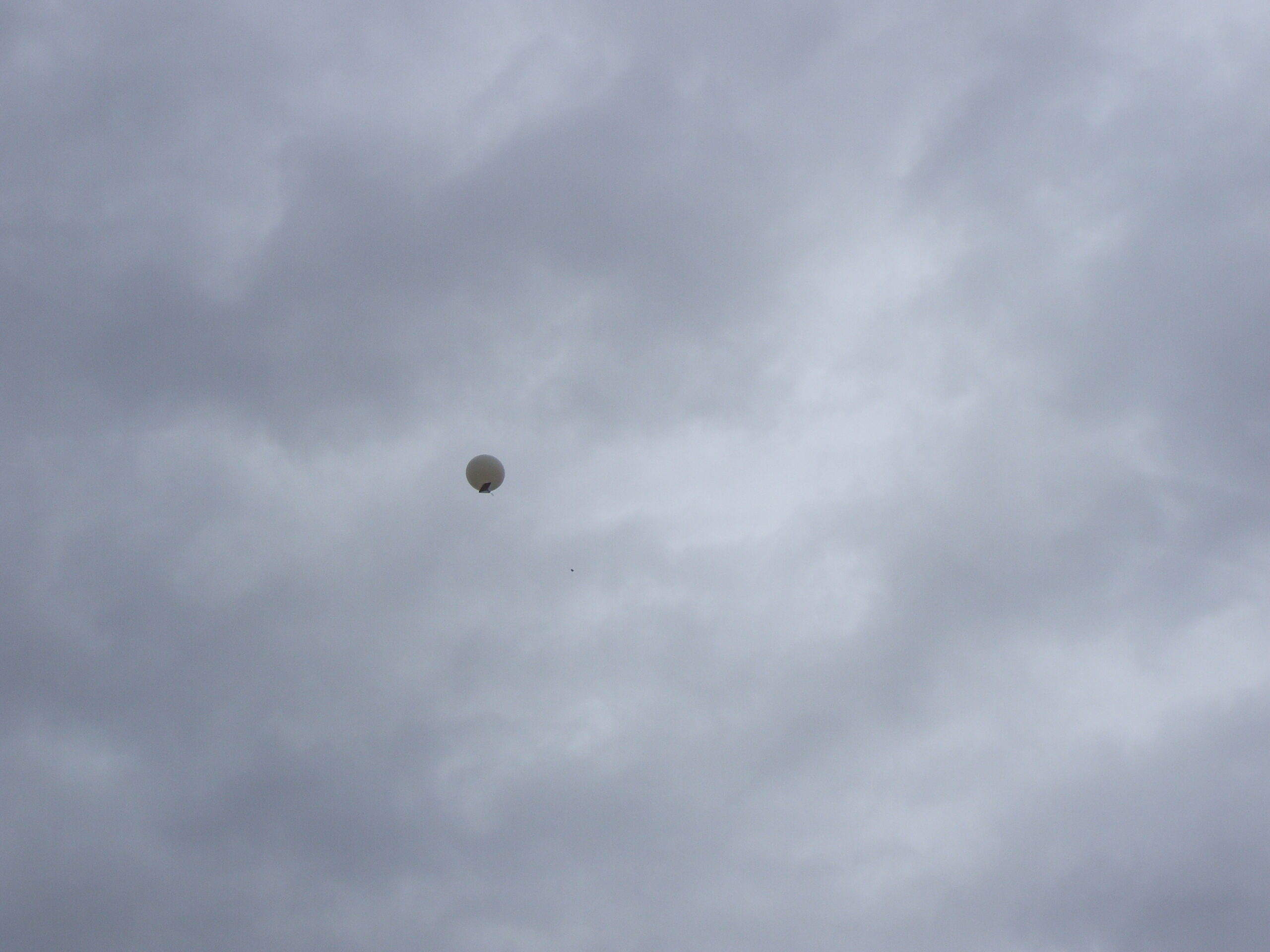 
Sending up the weather balloon which transmits its readings back to earth as it ascends...