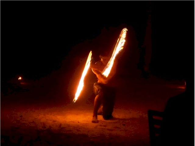 The resort puts on a fire juggling show for the guests.
