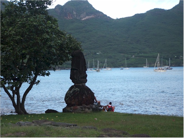 Sacred tikis at the marae - and all the yacht at anchor in the bay!
