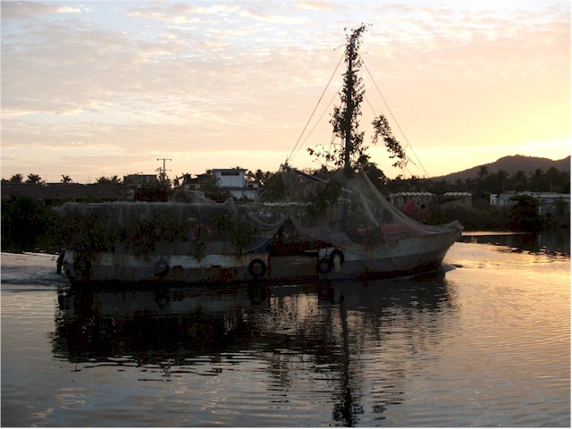 And finally, the Cuban Navy? A local fishing boat in camouflage during miitary exercises!
