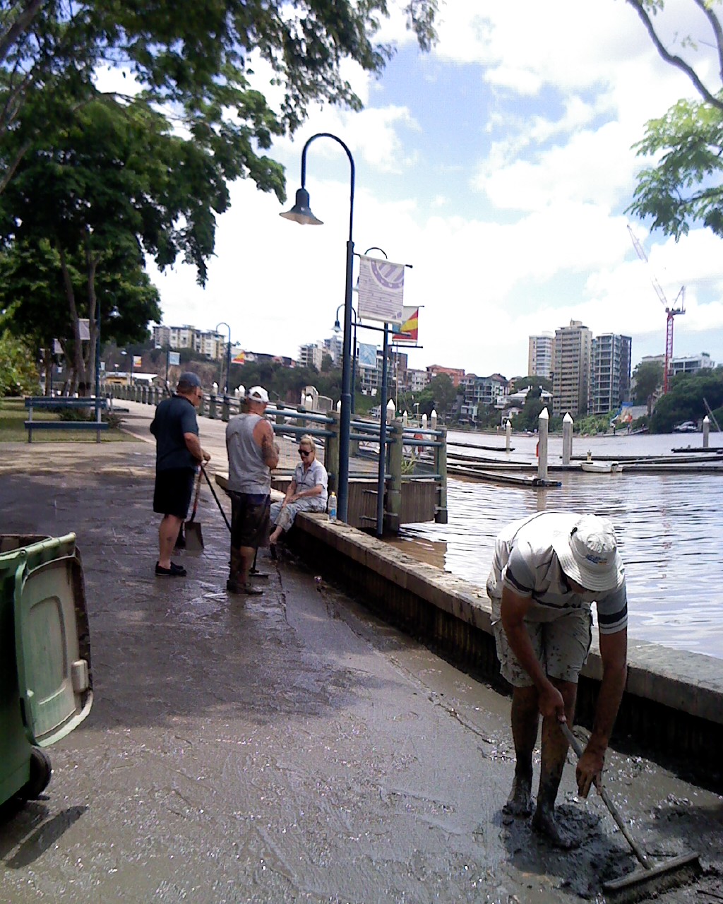 The lady in clean clothes sitting on the wall is the marina manager...
