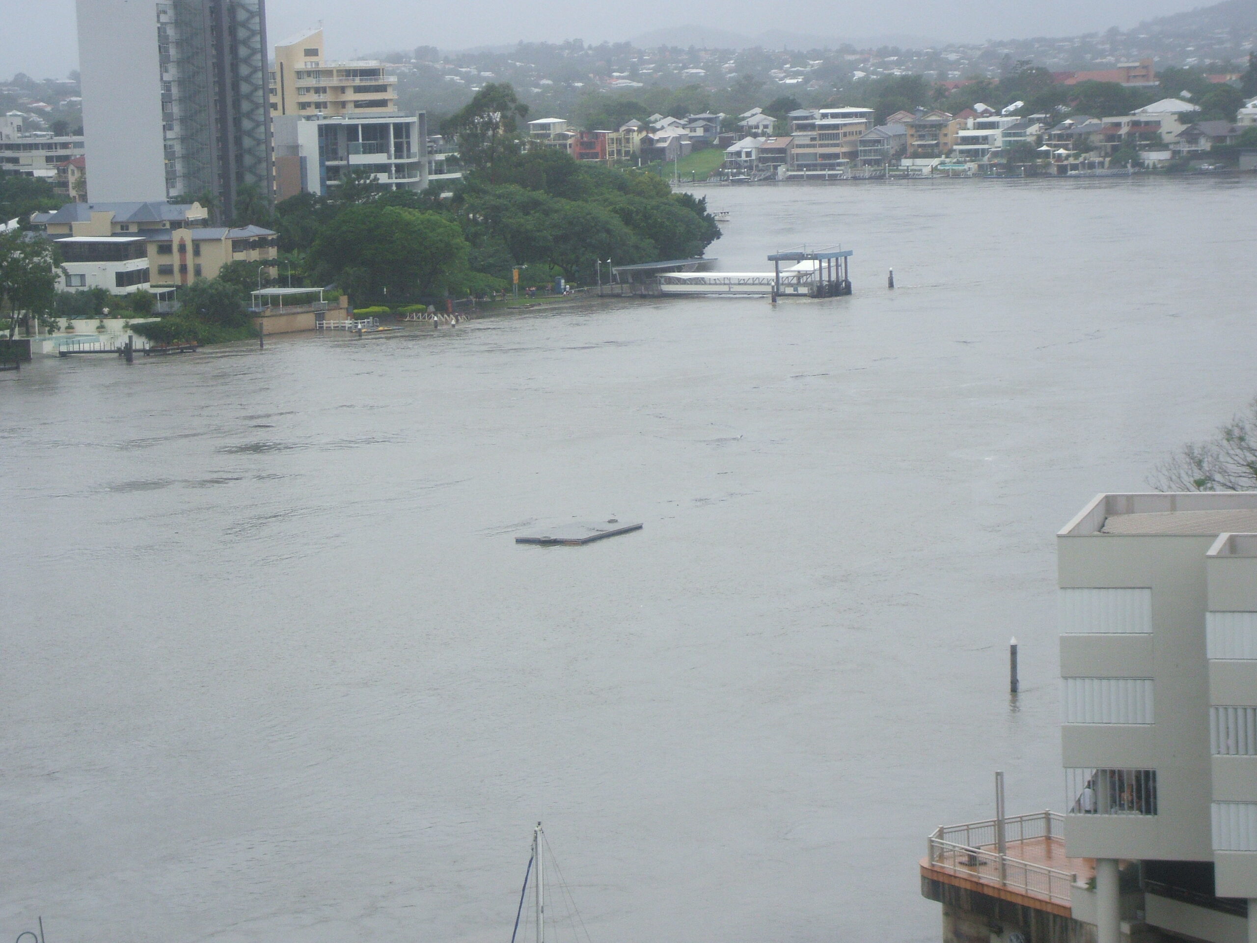 A pontoon floats down the river - and you can see Sydney Street ferry terminal in the distance...
