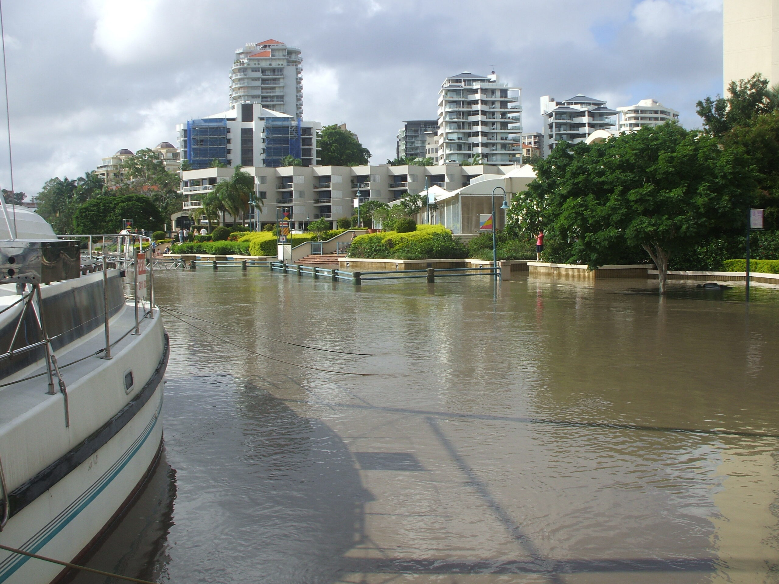 Water reaches the access path to the marina - and the catamaran on the left is still afloat...
