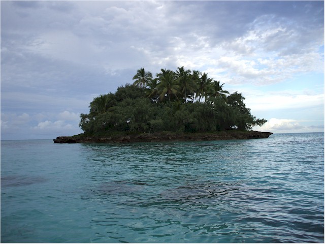 We spent a night at anchor just off this tiny island - note the coral heads!
