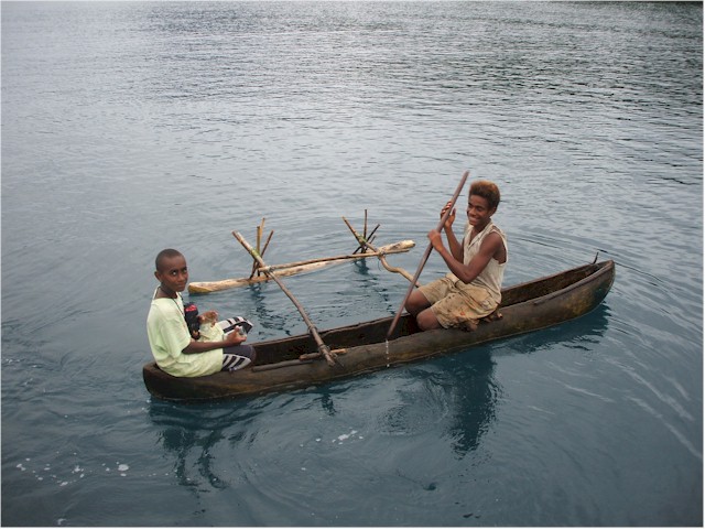 The boys paddled out to give us some coconuts as thanks for some gifts we had given them.

