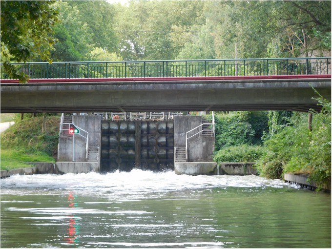 Approaching a lock: notice the low bridge to go under - as well as the turbulent water at the entrance!