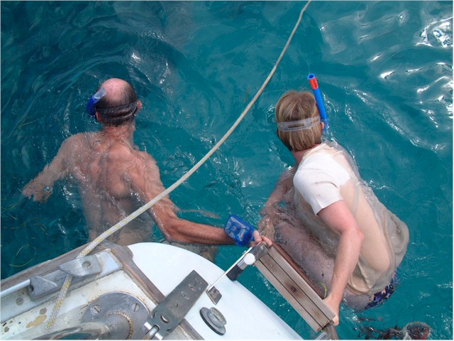 Doug & Shirley swimming off the back of the boat at Sombrero Reef.
