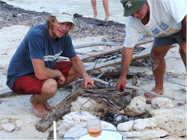 We both sail to Cayo Campos, a deserted island where we enjoy BBQ lobster...

