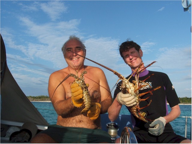 Success! It's lobster for dinner again. Keith & Vincent show off their catch ...

