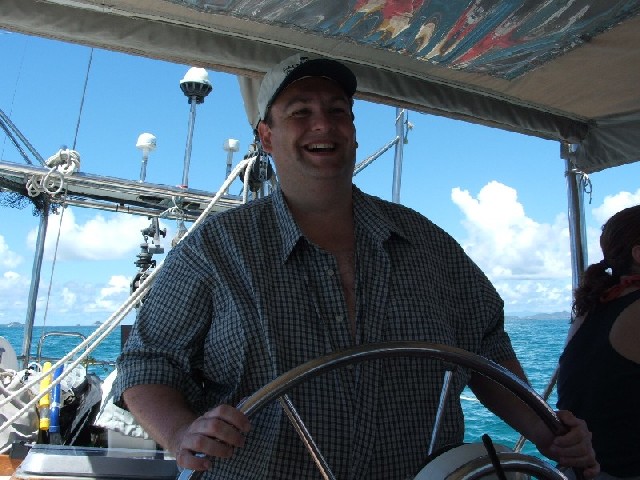 'Captain' Cal at the helm on our way to Tobago Cays...