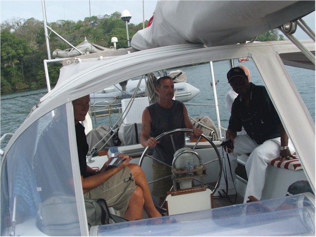 Ian (Ariel), one of our line-handlers at the helm and George, our second pilot.
