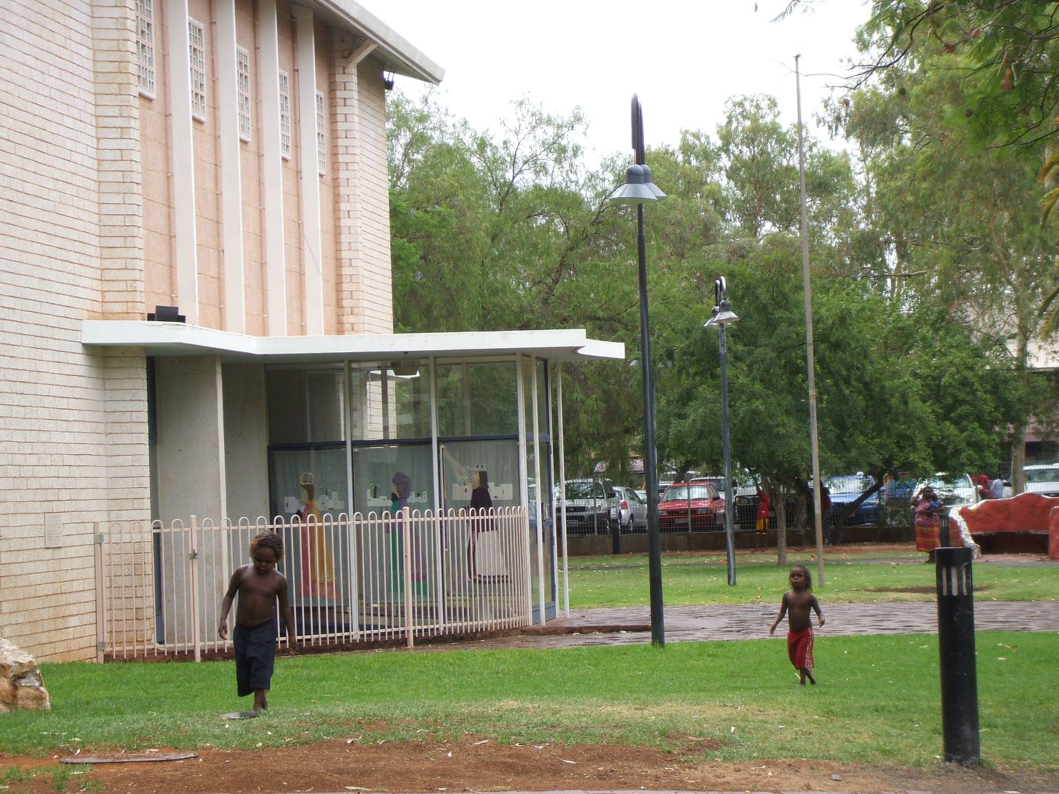 Aboriginal children playing in the rain at Alice Springs.