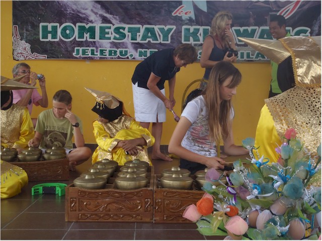 
We had an opportunity to try their local musical instruments - and see the 'bouquet' in the foreground; made from the dyed dessicated leaves of the rubber trees, with a boiled egg!