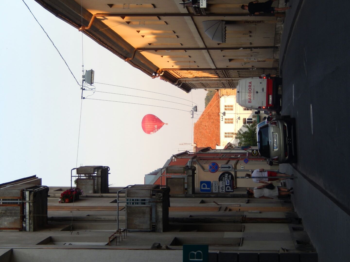 ... as a hot air balloon ascends over the city.
