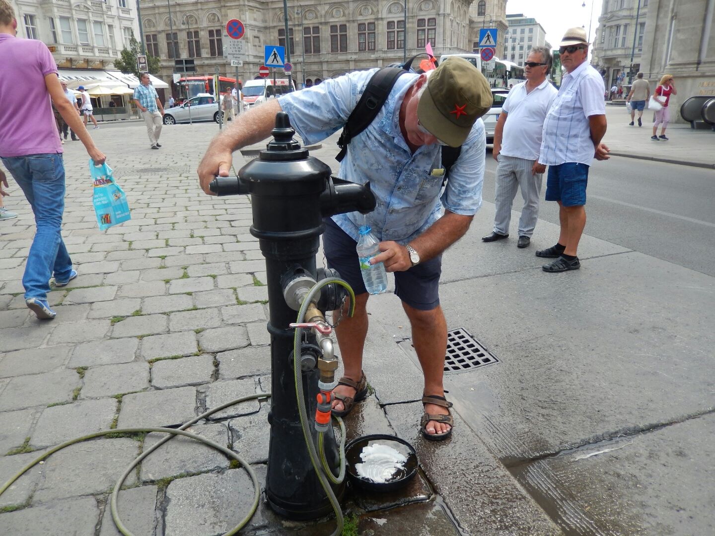 FIlling our water bottles with lovely cold water pumped from the Alps.
