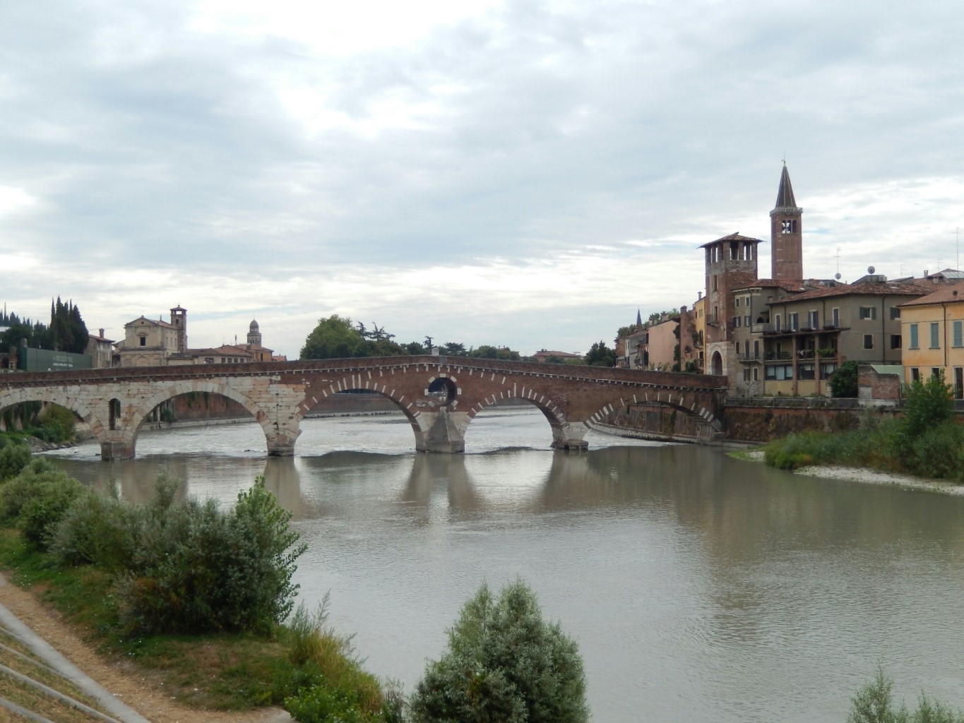 The Ponte Pietra completed in 100BC. Four arches of the bridge were blown up by retreating German troops in World War II, but rebuilt in 1957 with original materials.
