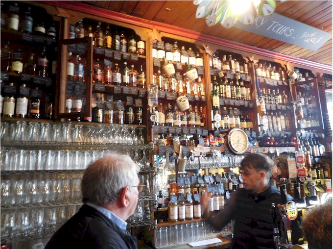 On the right of the entrance is the original bar...